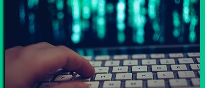 Website-Designer-Toms-River Website designer Toms River, hand poised over keyboard with green graphic on screen