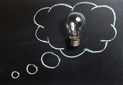 Manasquan furnace repair is a smart idea; clear lightbulb on chalkboard inside a white chalk cloud bubble